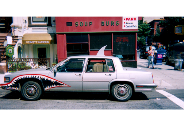 customized Cadillac car with shark fin and teeth